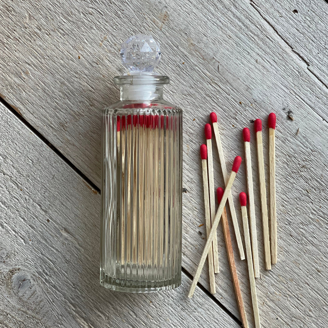 Matches in cut glass bottle